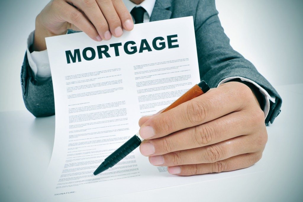 Man show mortgage document
