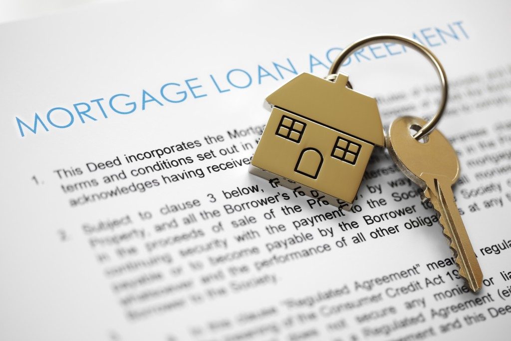 Mortgage loan application form with house keys