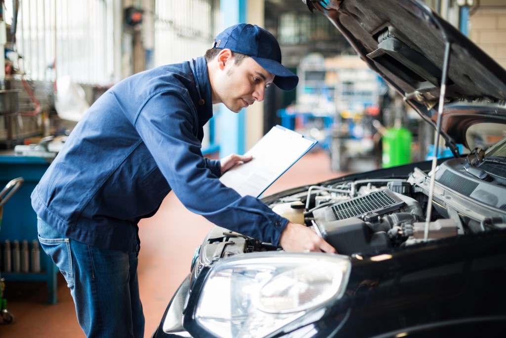 mechanic checking a car