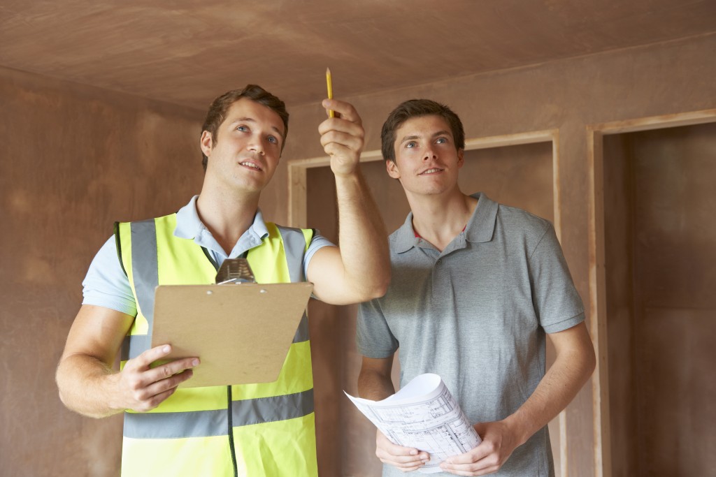 Inspector Looking At New Property