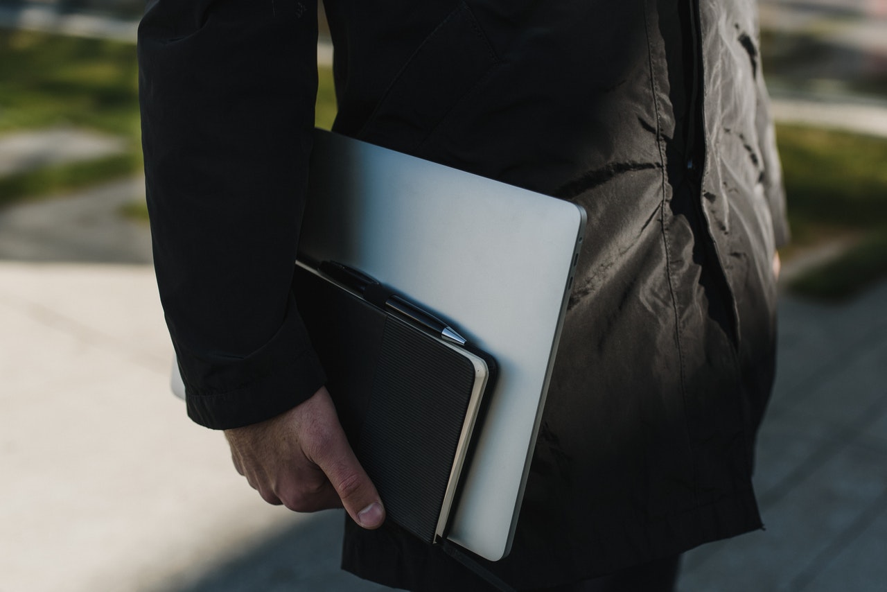 person holding his portfolio