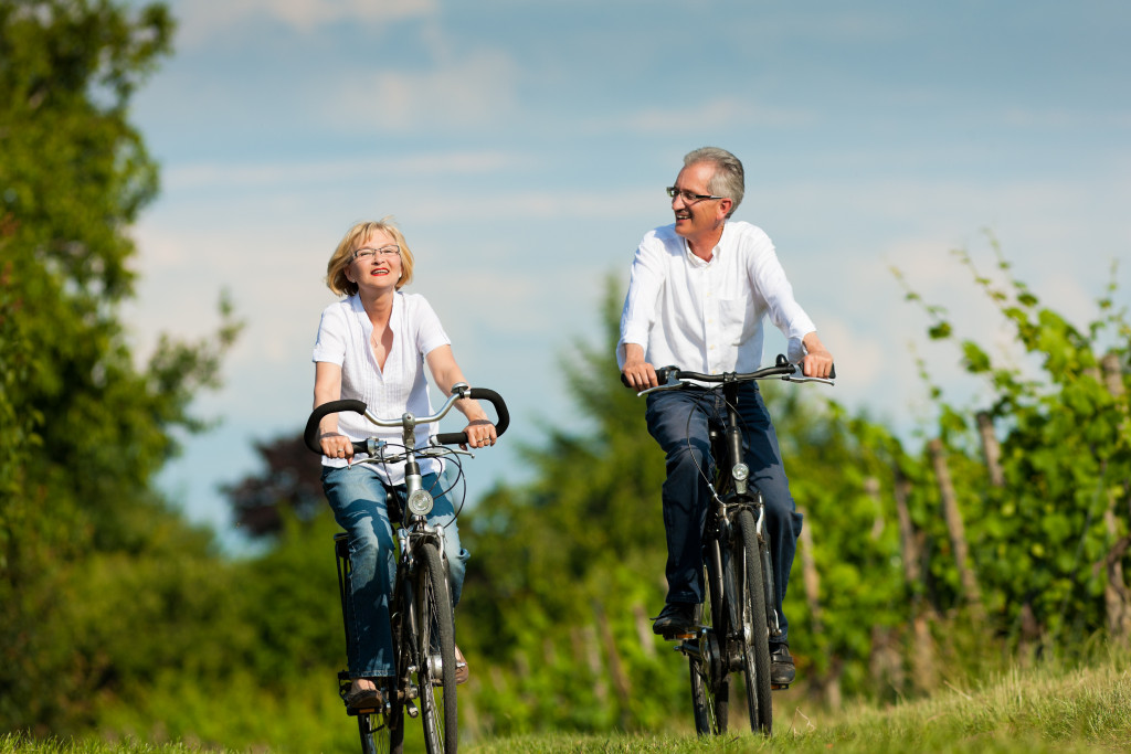 two senior couples biking