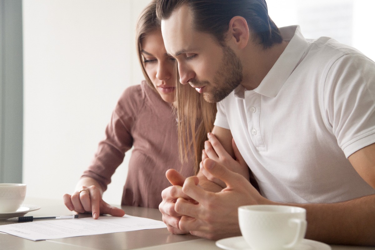 couple reading a document