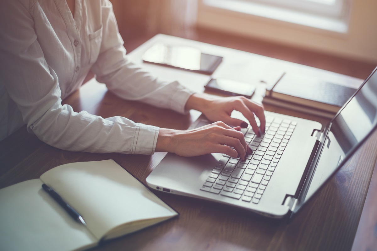 a woman working on her laptop